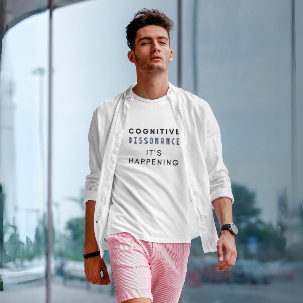 Cognitive Dissonance It's Happening t-shirt worn by a man.