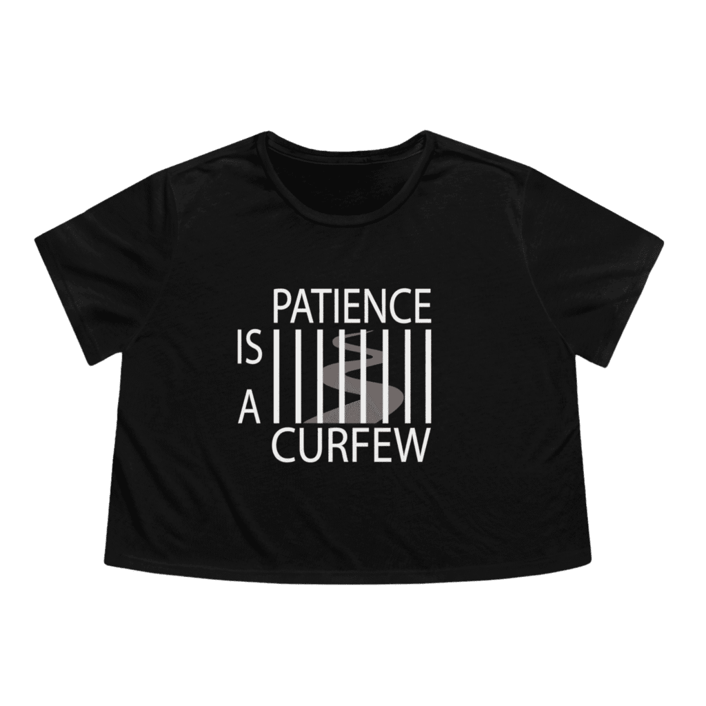 Patience Is A Curfew black crop top t-shirt, front view.