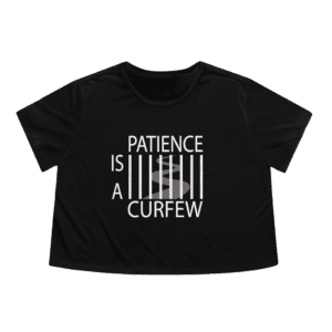 Patience Is A Curfew black crop top t-shirt, front view.