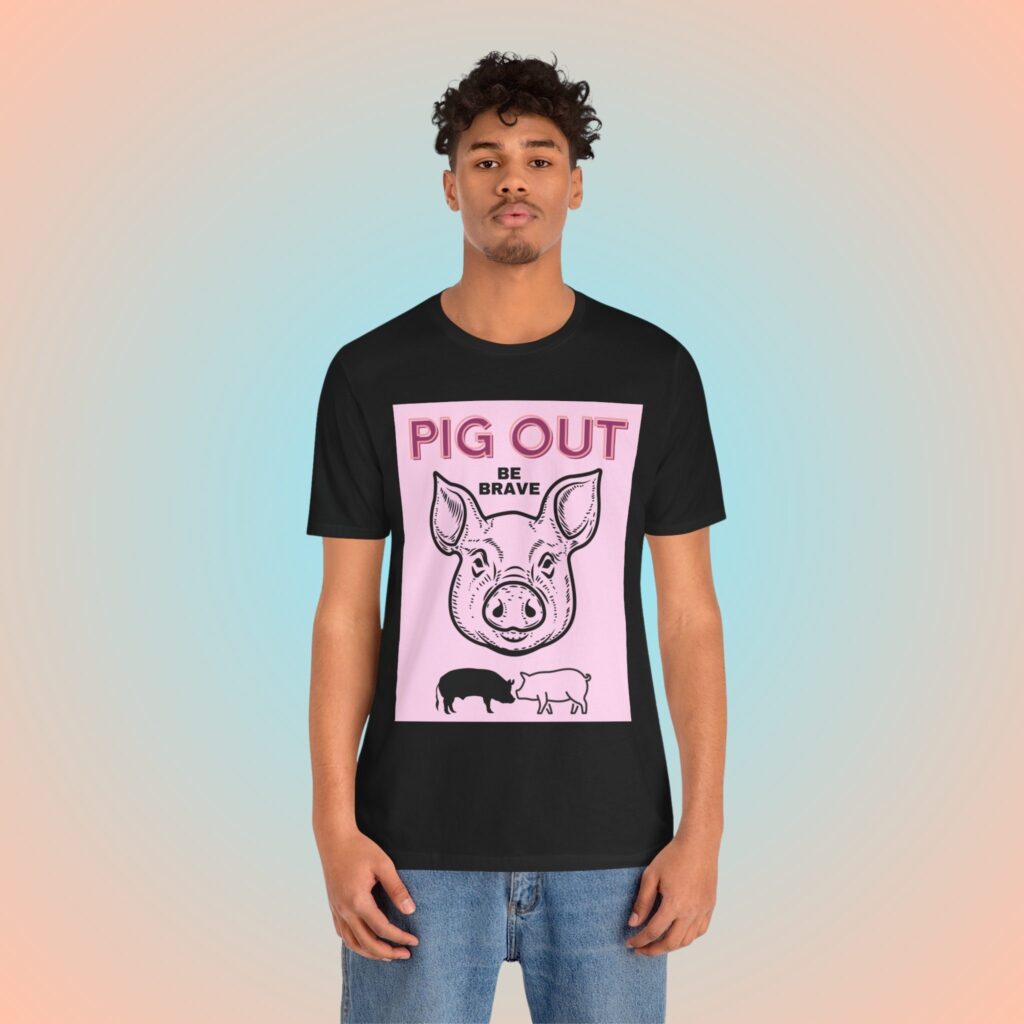 Pig Out Be Brave Pink t-shirt worn by a man.