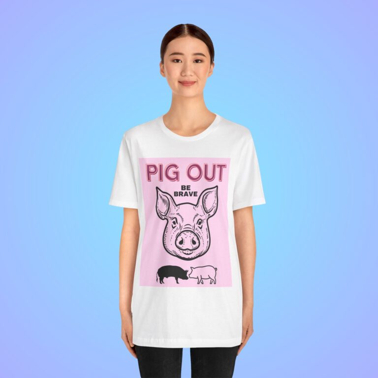 Pig Out Be Brave Pink t-shirt worn by a woman.