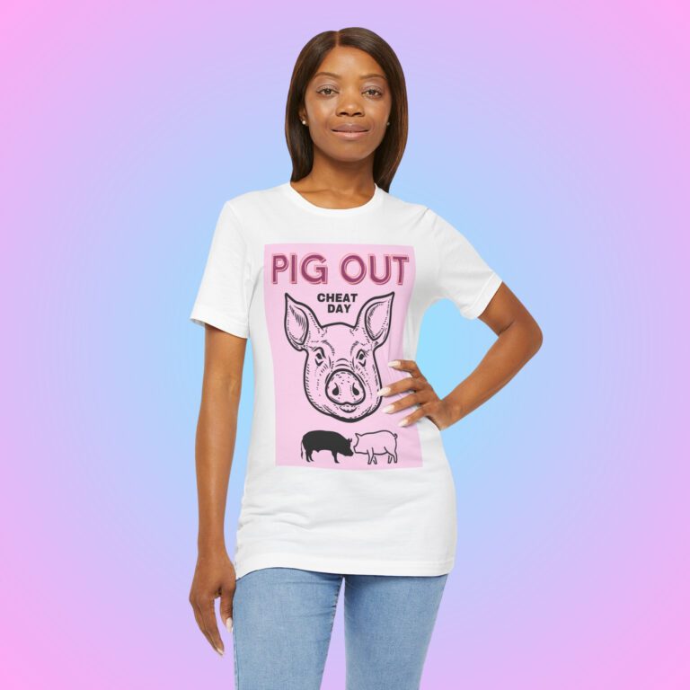 Pig Out Cheat Day Pink t-shirt worn by a woman.