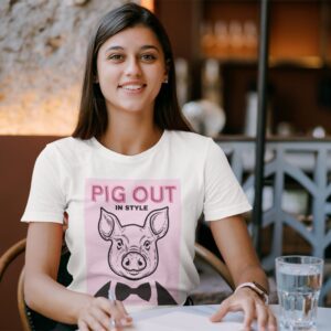 Pig Out In Style Pink t-shirt worn by a young woman.