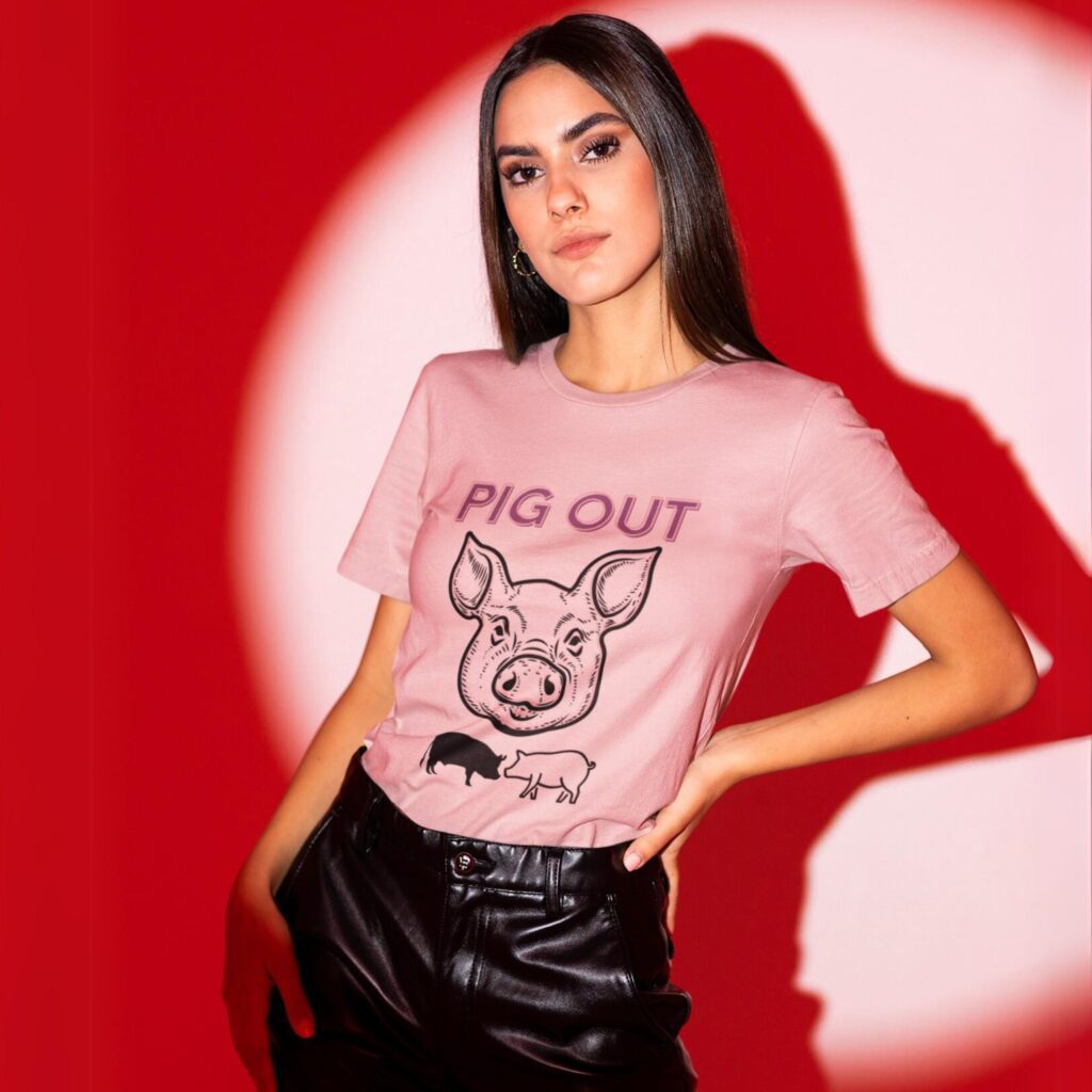 Pig Out t-shirt worn by a woman.