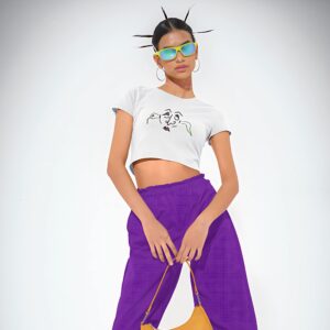 Gossip Snake white crop top t-shirt worn by a woman.